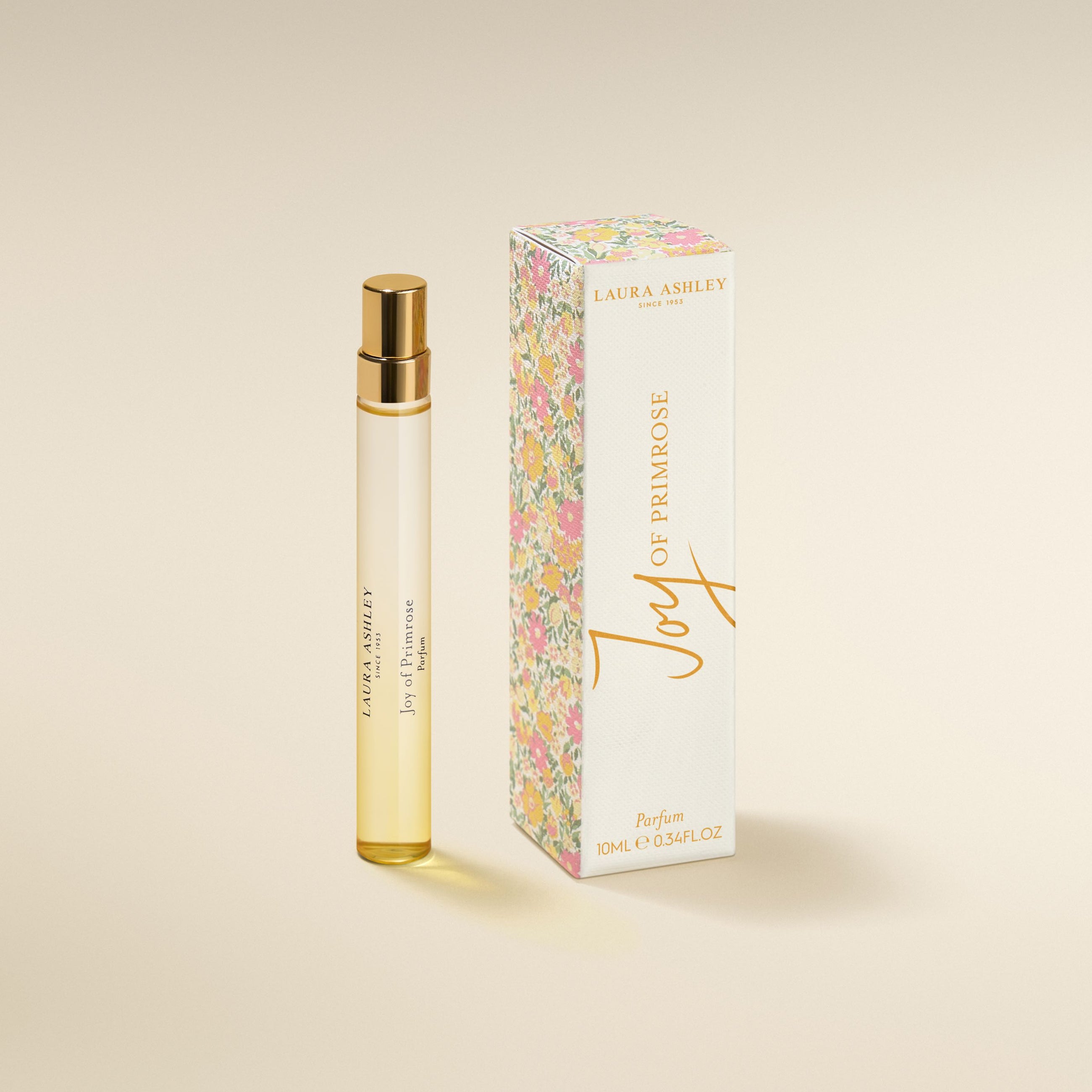 Laura Ashley 'oy of Primrose perfume bottle and packaging on a beige background