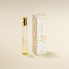 Laura Ashley 'oy of Primrose perfume bottle and packaging on a beige background