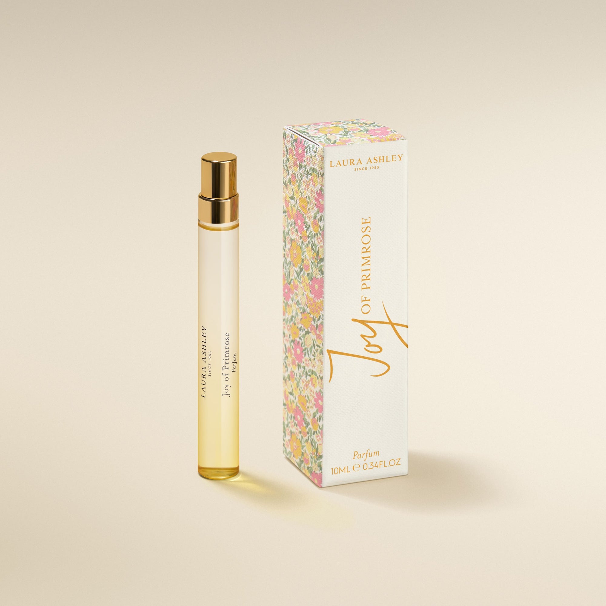 Laura Ashley 'oy of Primrose perfume bottle and packaging on a beige background