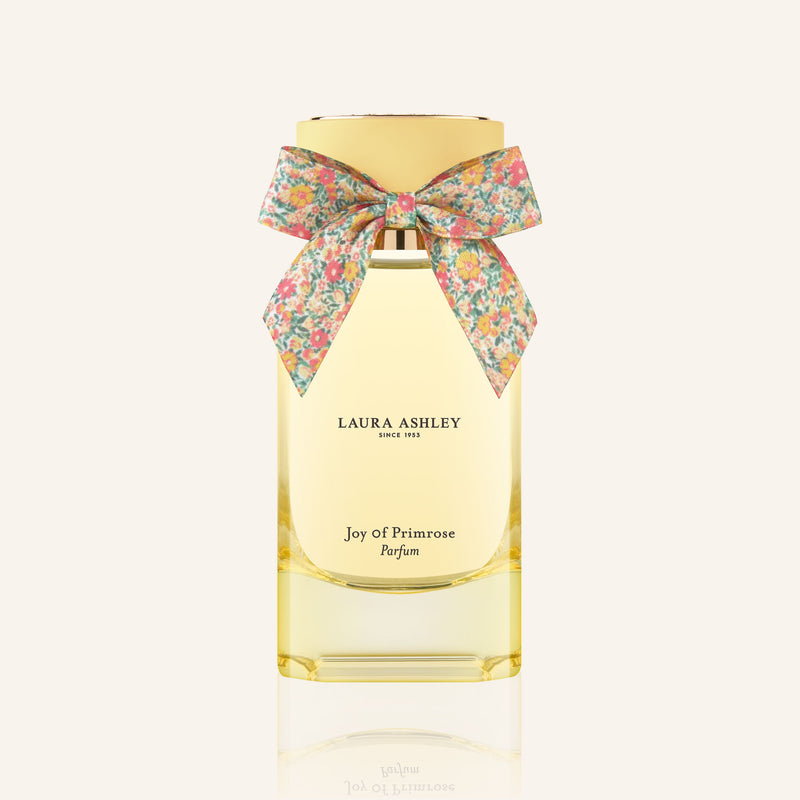 Laura Ashley perfume bottle with a floral bow on a white background