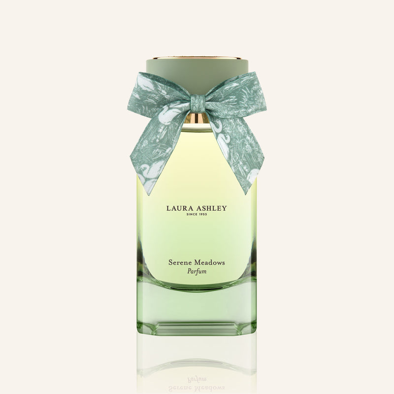 Laura Ashley Serene Meadows perfume bottle with a bow on a white background