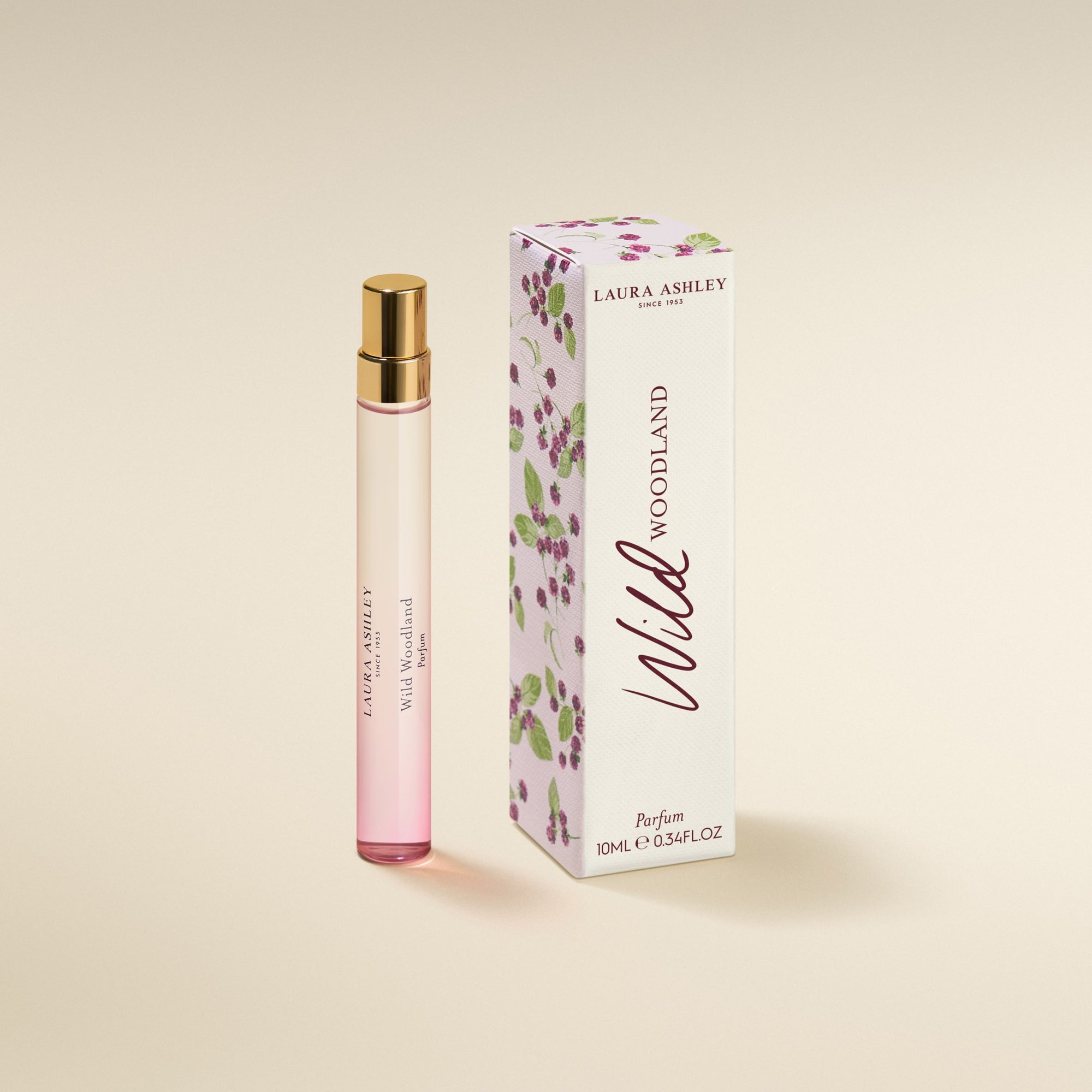 Laura Ashley Wild Woodland perfume bottle and packaging on a beige background