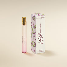 Laura Ashley Wild Woodland perfume bottle and packaging on a beige background
