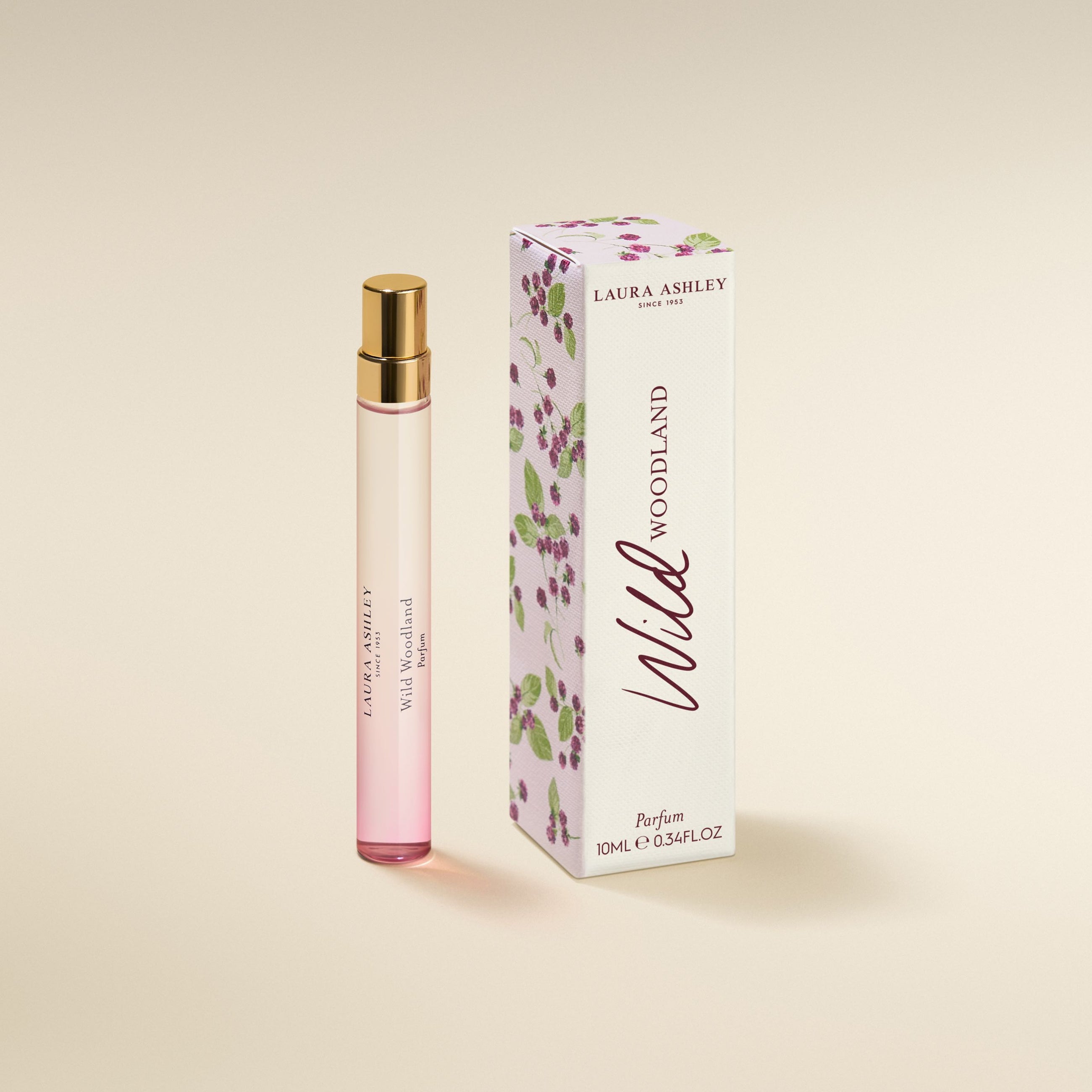 Laura Ashley Wild Woodland perfume bottle and packaging on a beige background