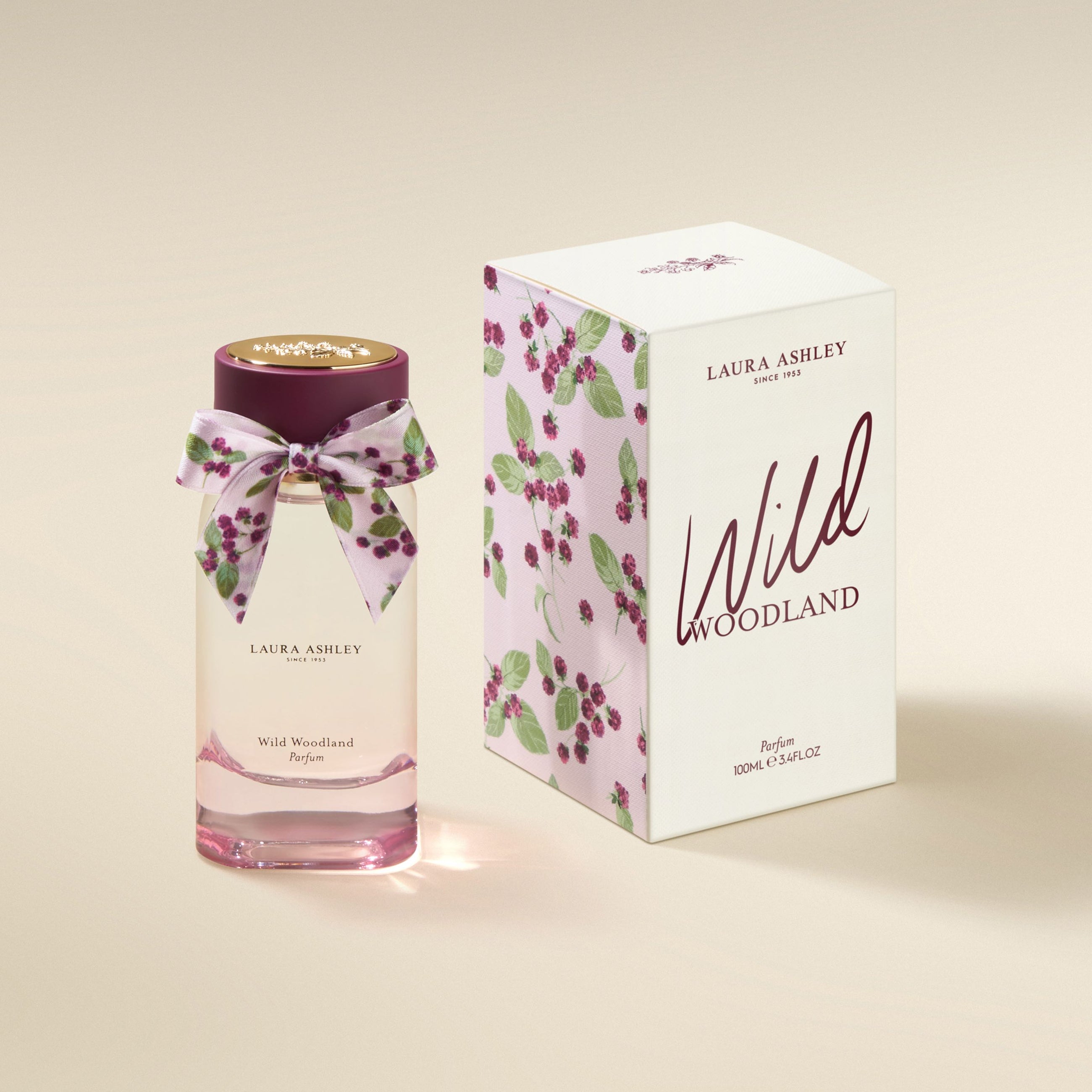 Laura Ashley Wild Woodland perfume bottle and packaging on a beige background