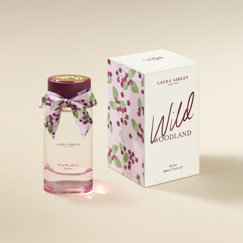 Laura Ashley Wild Woodland perfume bottle and packaging on a beige background